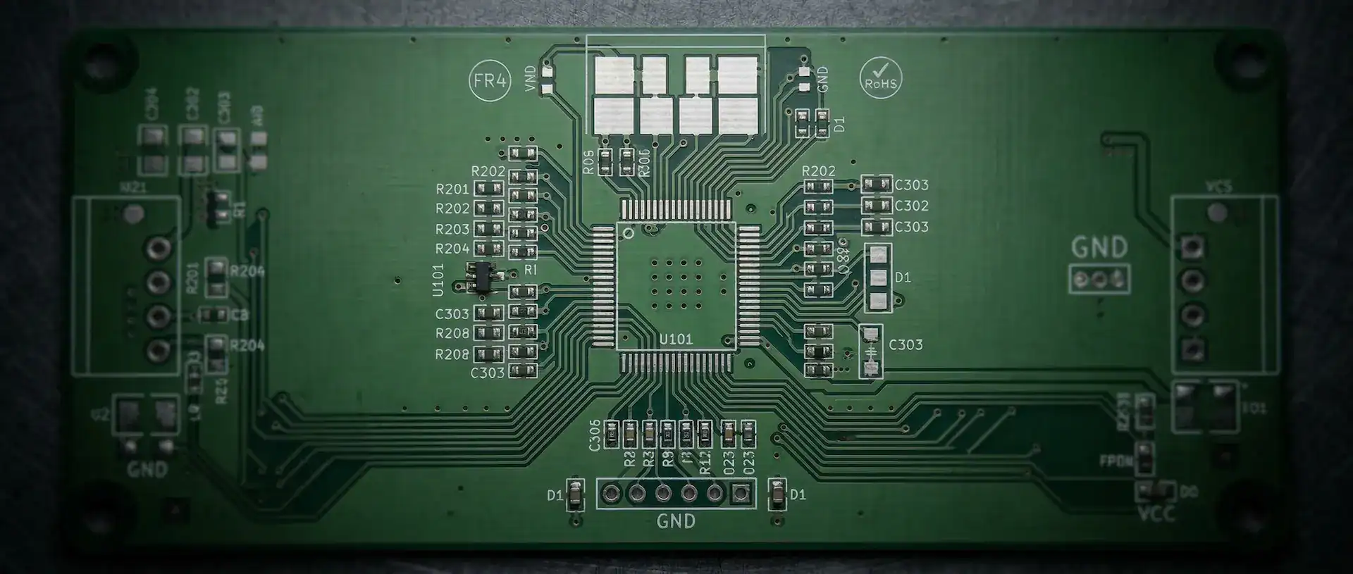 Rapid PCB prototyping - green FR4 circuit board with precision traces and components