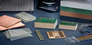 Copper-clad laminate samples, a multilayer PCB cross-section, and qualification evidence arranged for IT-140 material approval