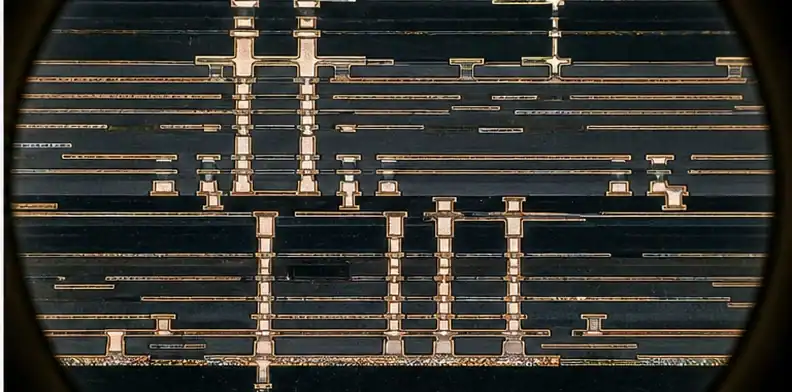Fine build-up routing is inspected under magnification for an ABF substrate decision.