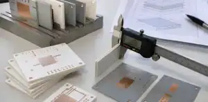 An engineering bench reviews ceramic pcb thickness with ceramic substrate samples and copper measurement notes.