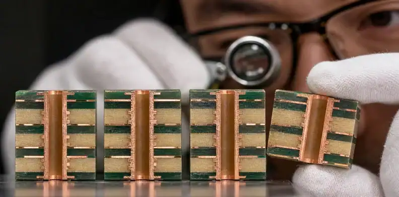 A drill-to-land cross-section demonstrates design margin in hybrid PCB layer registration