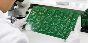 Lead-free HASL PCB panel inspected under a laboratory magnifier