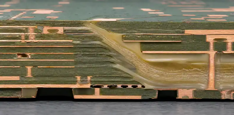 A manufacturing view of multilayer PCB resin flow showing a stepped board structure under review.