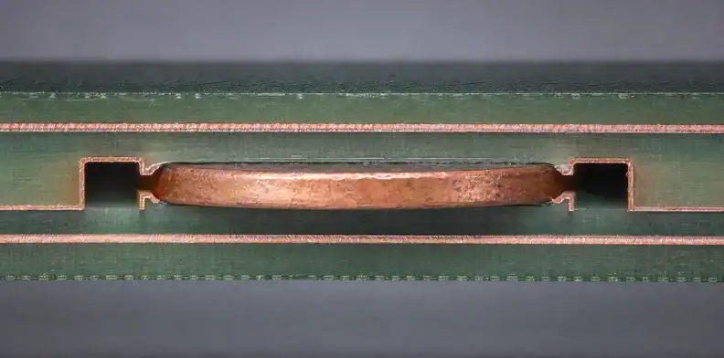 A manufacturing view of multilayer PCB resin flow showing a first-article cross-section for lamination evidence.