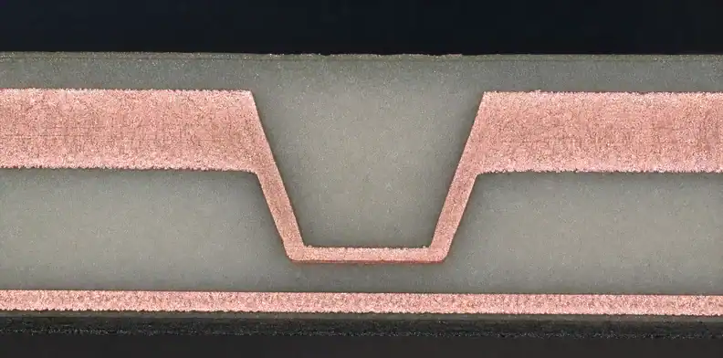 A manufacturing view of pCB pattern plating showing plated copper profile and trace-edge geometry.