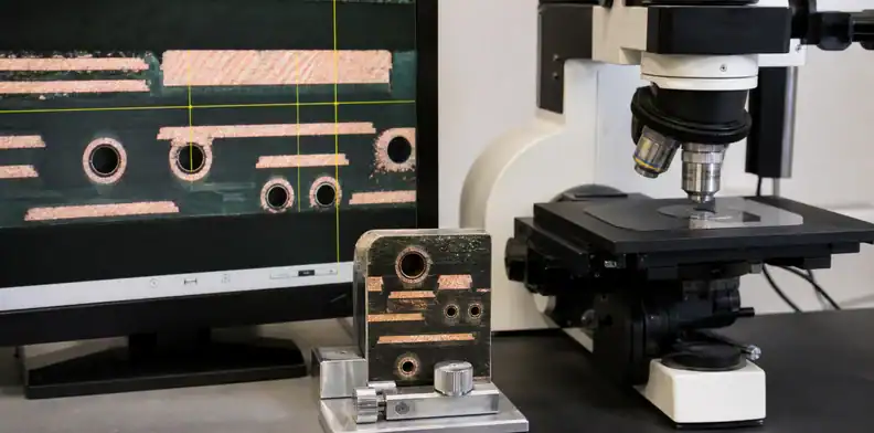 A manufacturing view of pTH hole-wall metallization showing microsection evidence for a controlled hole.