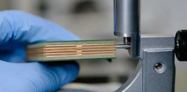 A manufacturing view of pTH hole-wall metallization showing first-lot inspection and release evidence.