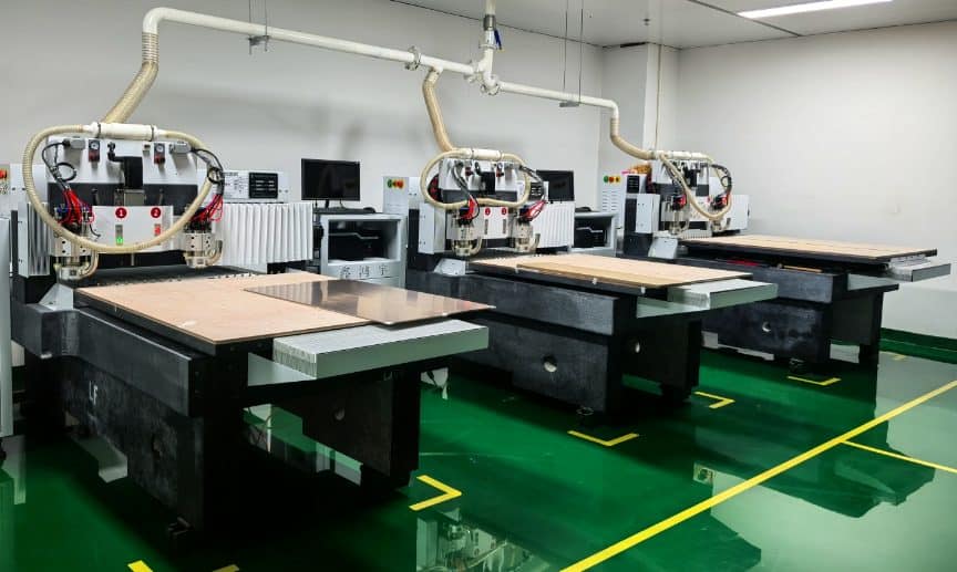 CNC routing machine for PCB profiling at the Queen EMS factory