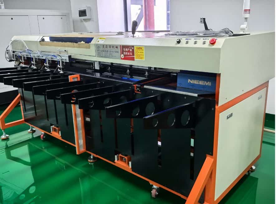 V-cut scoring machine for PCB panels at the Queen EMS factory